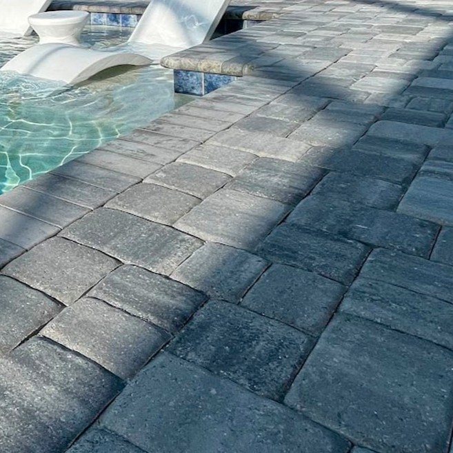 Gray porcelain pavers along a pool deck